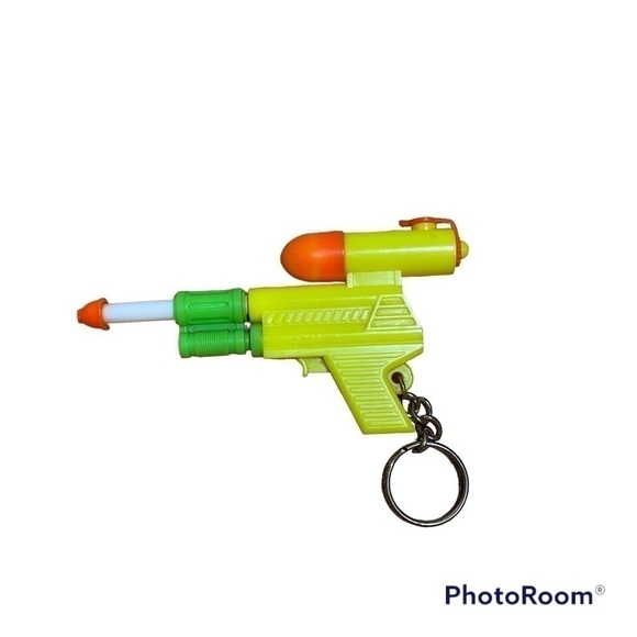 Vintage Super Soaker Keychain Pump Action Squirt Gun Green Yellow 90s - Picture 1 of 3